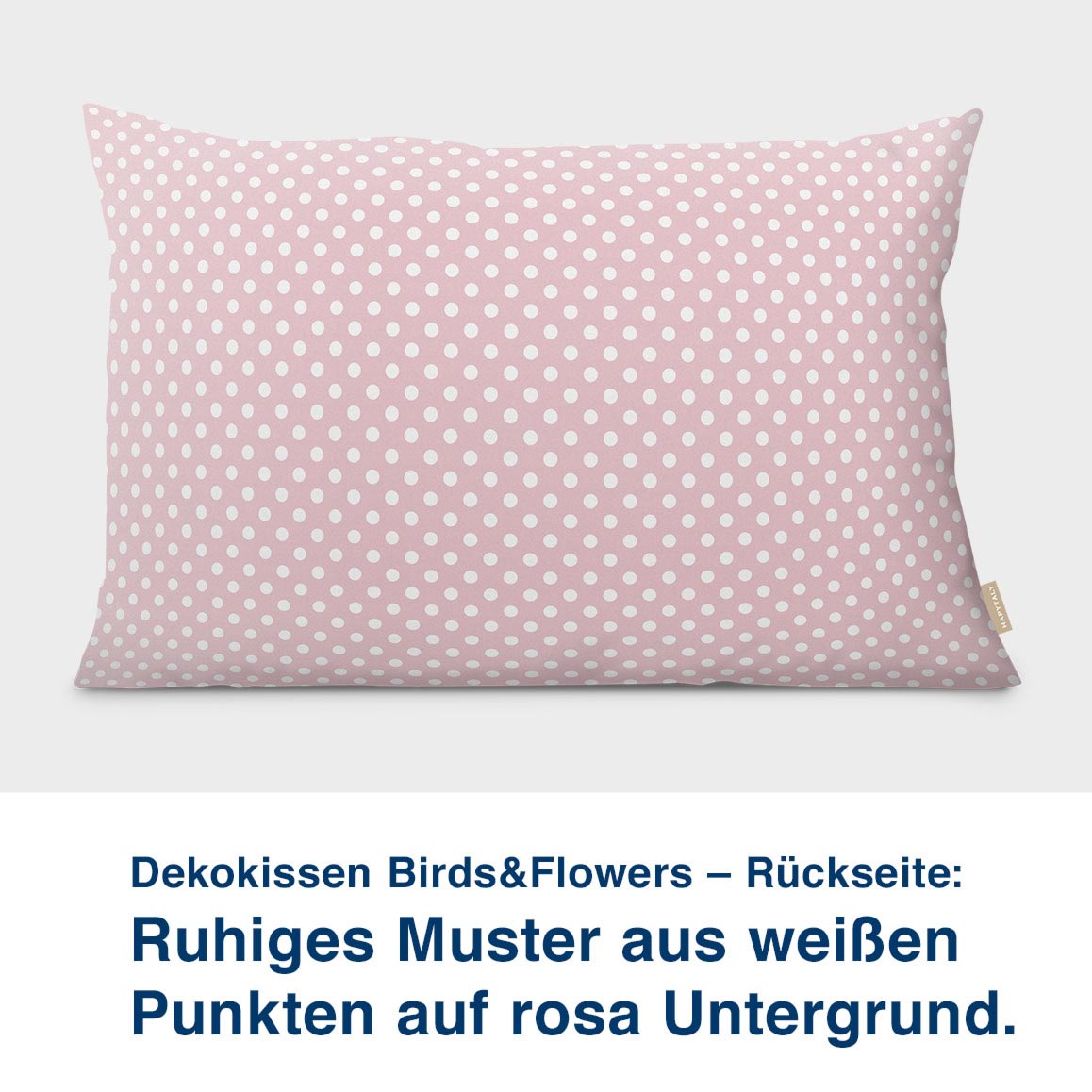 Dekokissen Birds&Flowers – Rückseite:  Ruhiges Muster aus weißen  Punkten auf rosa Untergrund. UNtergrund die Farben des Meeres.